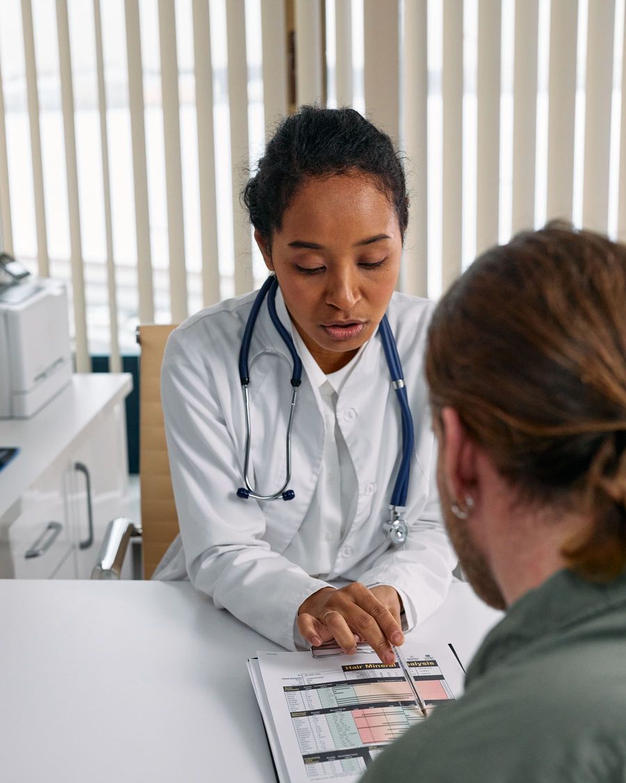 A physician talking with a patient during a consultation