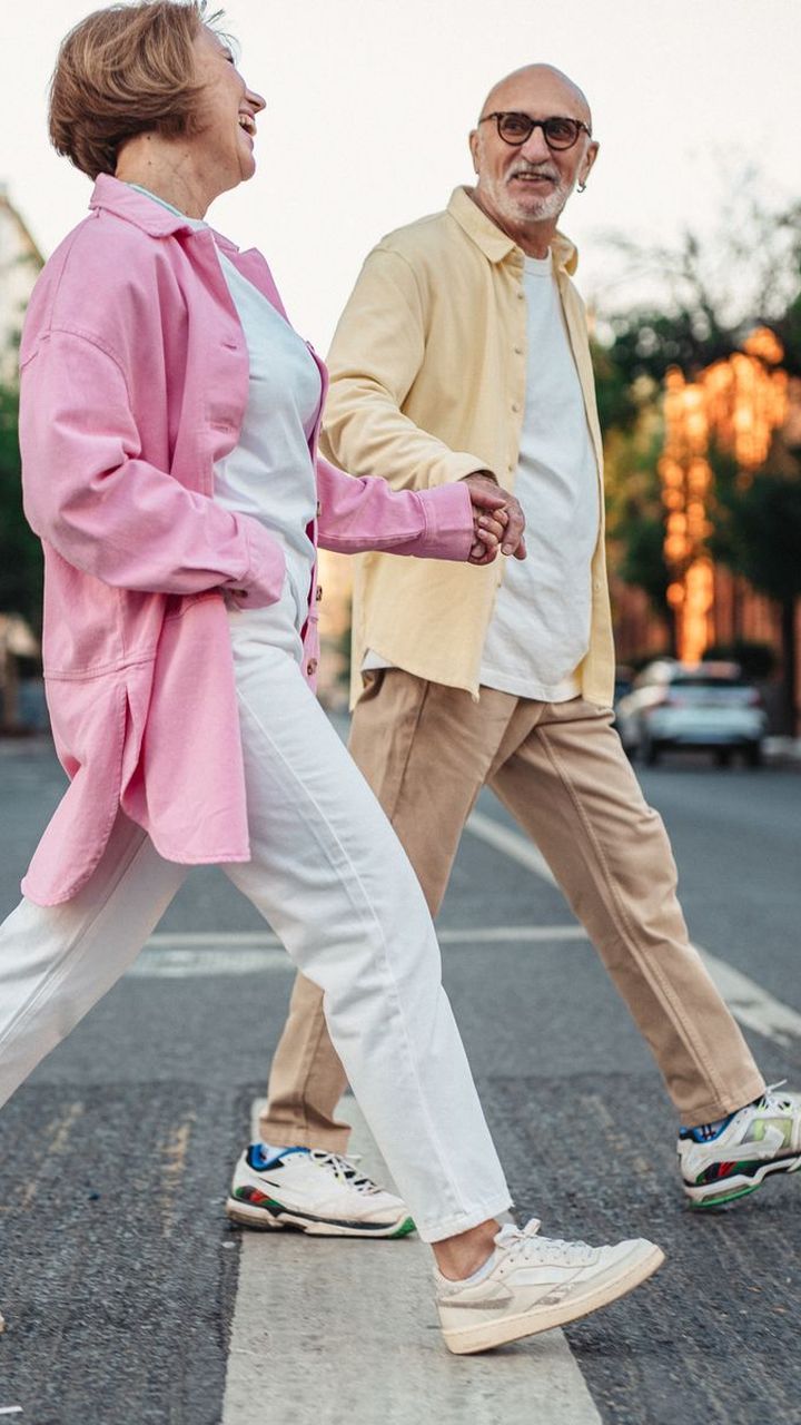 An older couple walking outdoors